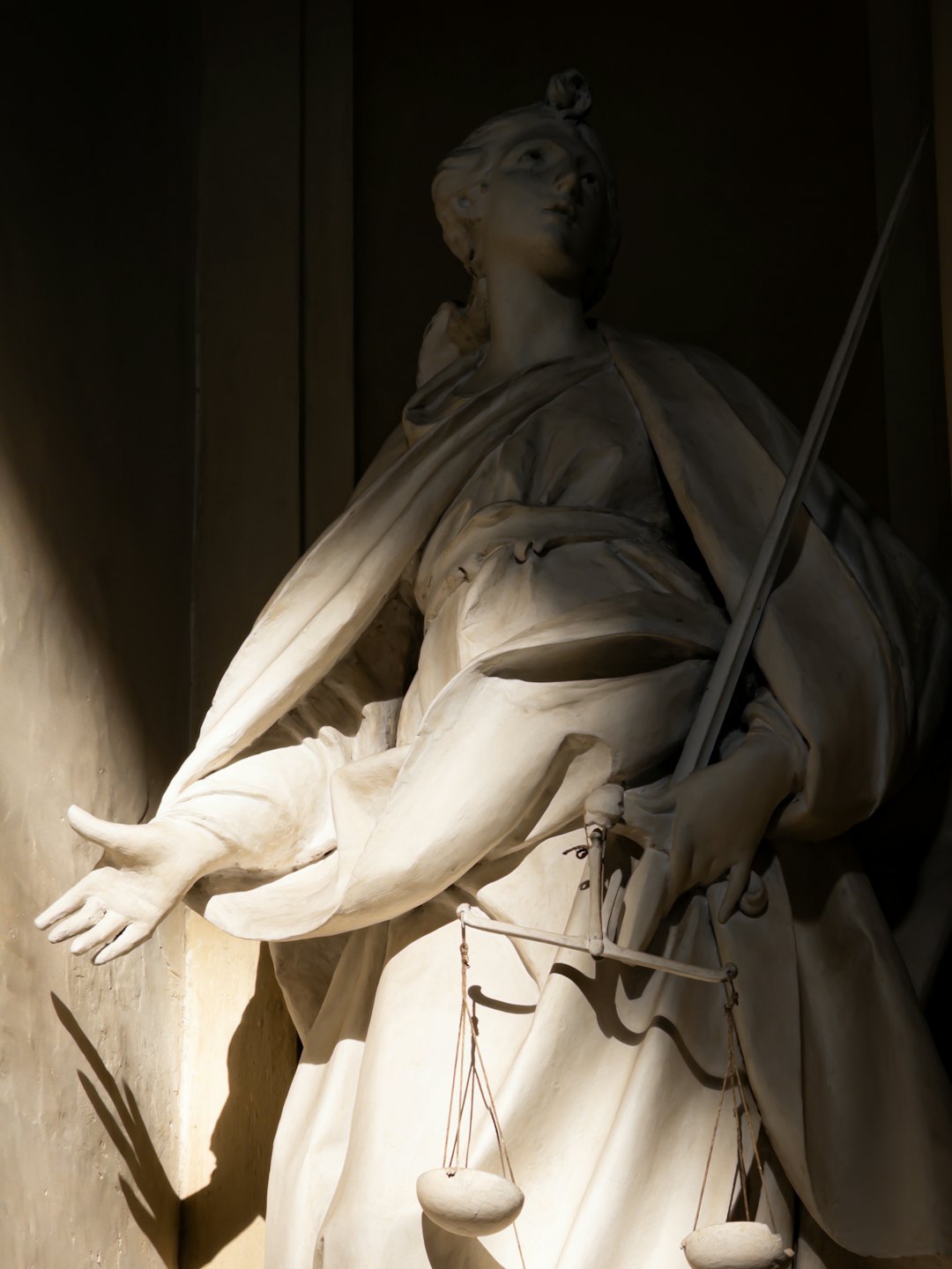 Statue of Lady Justice holding sword and scales